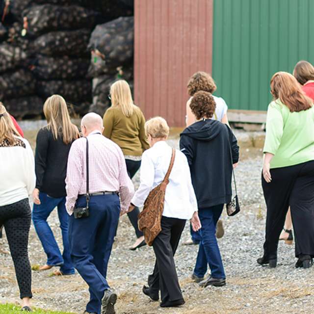 Tour group at Meadwbrooke Gourds touring harvested gourds facility