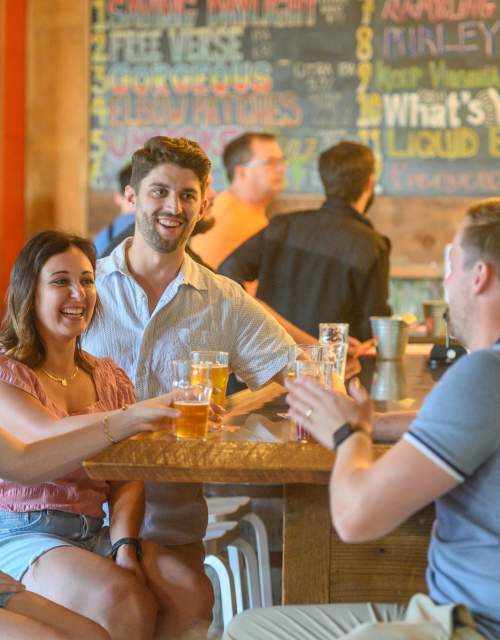 Group of young adults drinking at a brewery