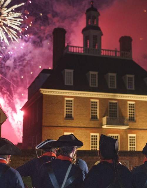 Colonial soldiers watching fireworks go off on the 4th of July