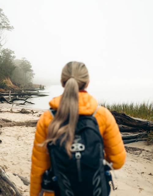Woman hiking at York River State Park Fossil Beach