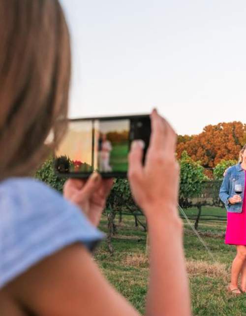 Family poses for photo at winery