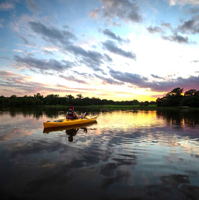 Visitors kayaking on Waterloo Lake in Denison, Texas