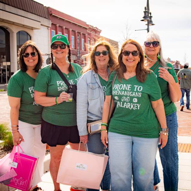 Group dressed in green celebrating St. Patrick’s Day in Downtown Denison
