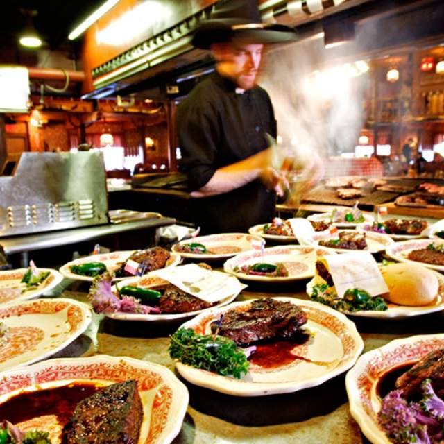 many dishes of steaks plated ready to be served at the big texan steak ranch in amarillo, texas