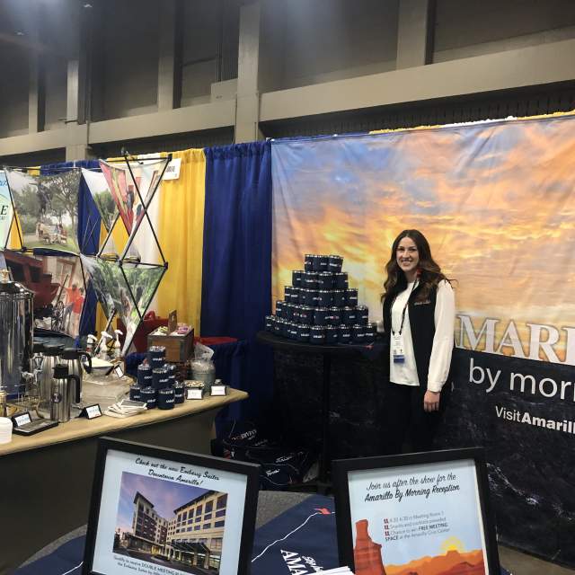 Trade show booth featuring CVC staff