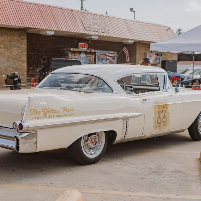 Classic car with The Yellow Rose and Route 66 Decal on it