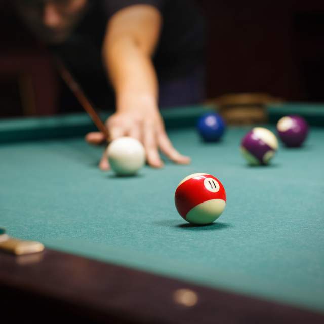 Image Alt Text close up of billiards game in progress