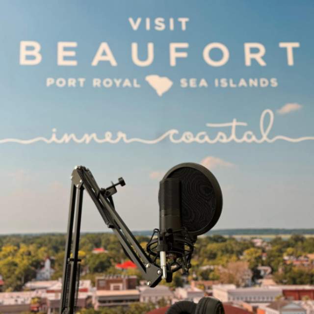 Microphone in front of a photo of downtown Beaufort