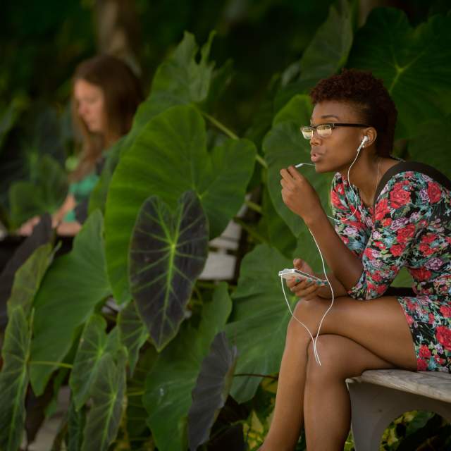 northern kentucky university student sitting outdoors on campus