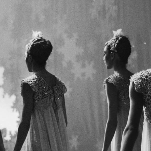 Black and white photo of five ballet dancers backstage at the Cincinnati Ballet