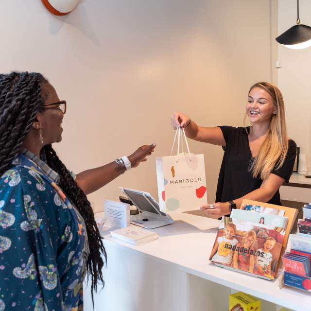 Woman checking out at a boutique