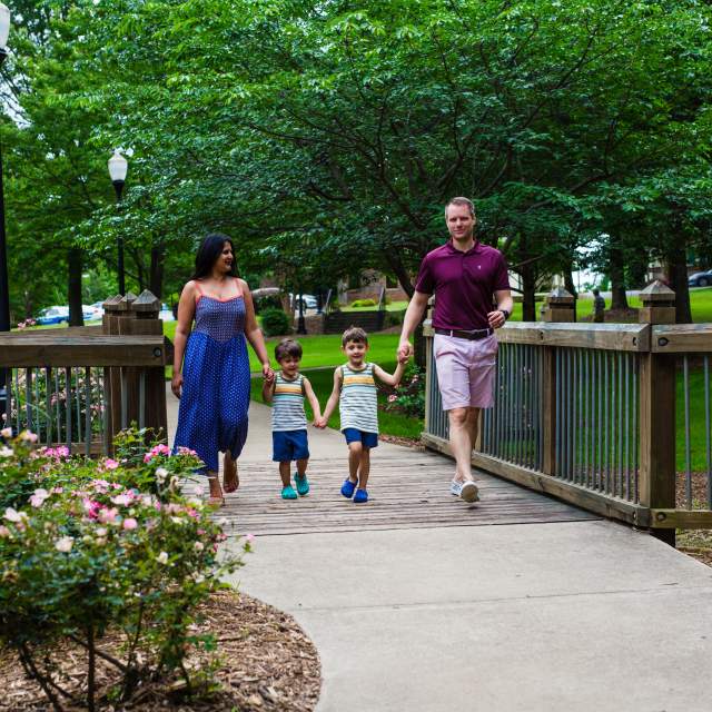 Family walking through a park