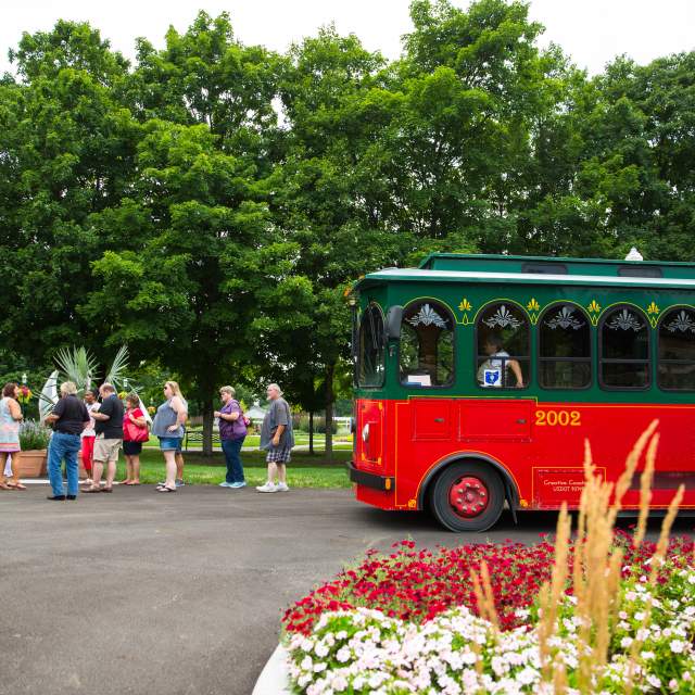 Group of people getting off trolley