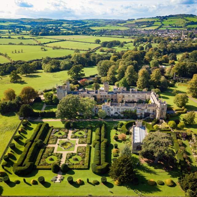 Aerial view of Sudeley Castle amongst rolling hills