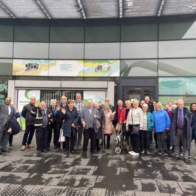 People standing outside the Coventry Transport Museum