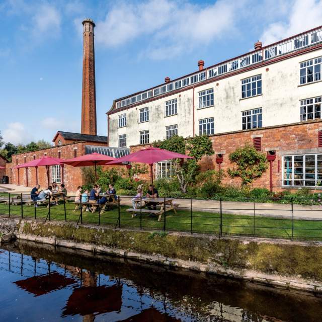 The image shows Coldharbour Mill, located in Uffculme, Devon, England