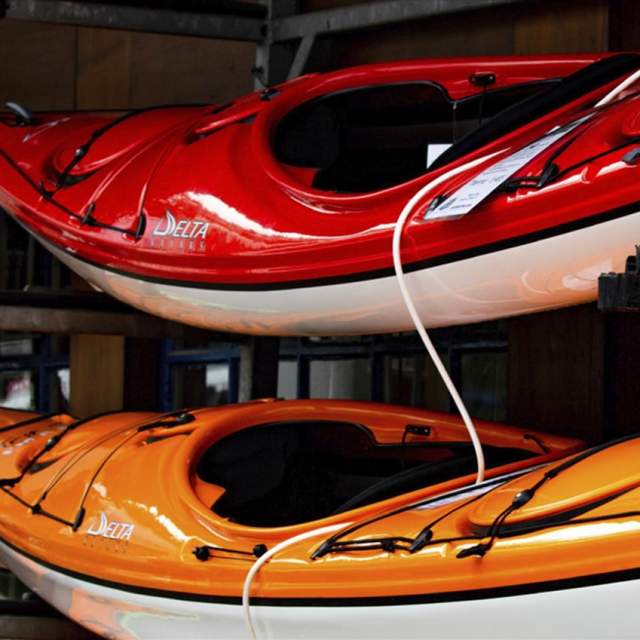 canoes stacked in storage
