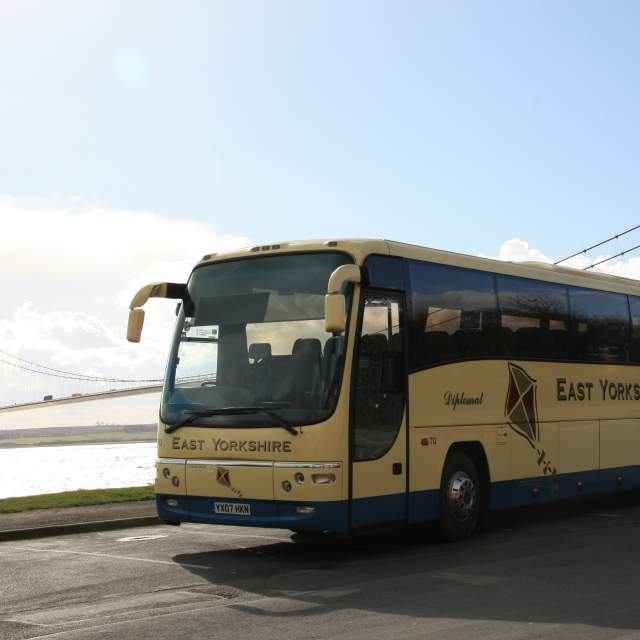Coach parked, Humber Bridge in the background, A single span suspension bridge