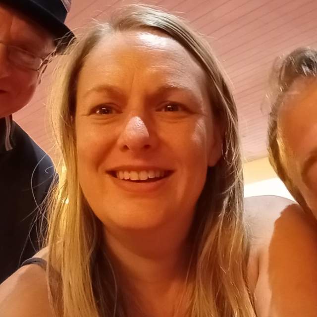 3 People smiling in Selfie style photo