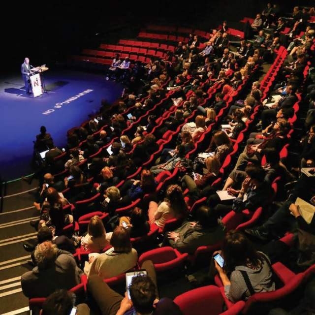 Audience watching someone on stage