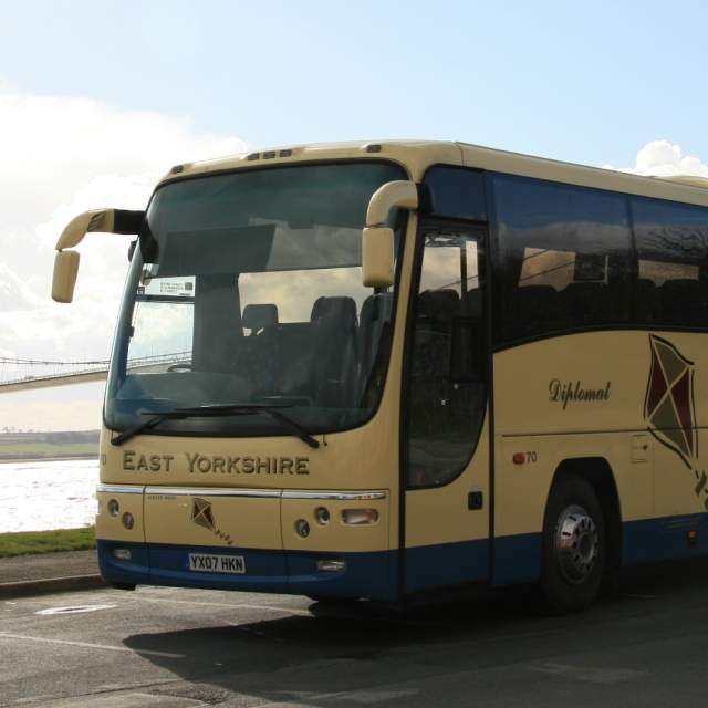 East Yorkshire Coaches bus parked near the Humber Bridge, Hull with riverside views.