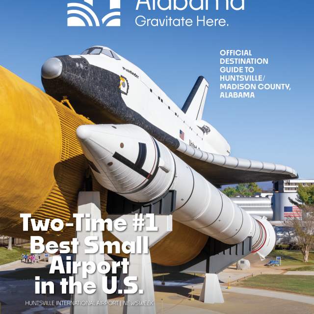 Photo of the space shuttle Explorer at the U.S. Space & Rocket Center on a bright sunny day with clear blue skies.