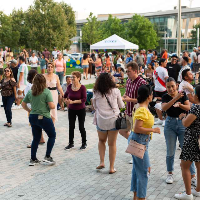 People dancing at Viernes Cultural Latin Night.