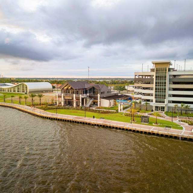 Lake Charles lakefront with a walking path exterior of Port Wonder, Crying Eagle Lakefront, and the parking garage
