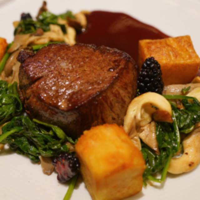 Bison Filet Mignon served with duck fat Brabant potatoes, oyster mushrooms, swiss chard, pickled blackberries, and blackberry demi glase
