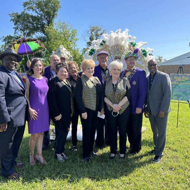 group photo at the mardi gras museum grounds
