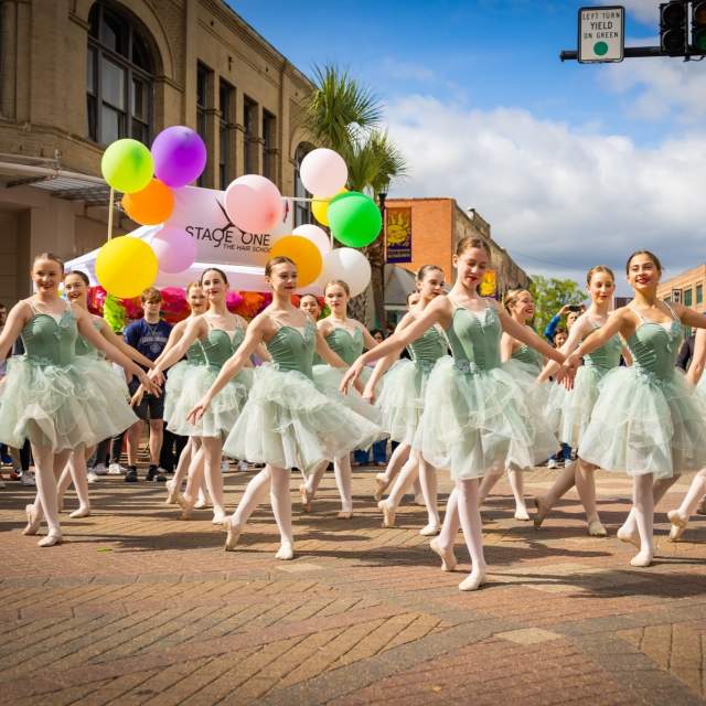 ballerinas in green costumes dance in downtown lake charles