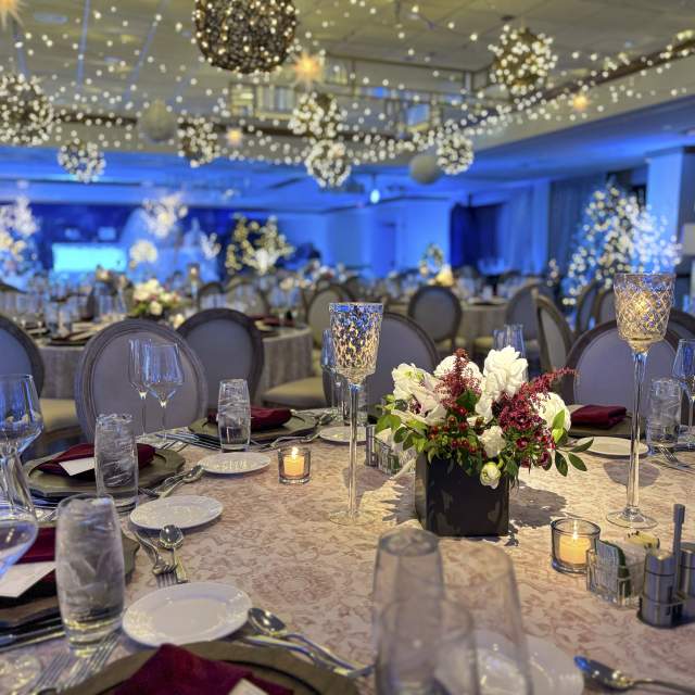 A room at the Grand Geneva decorated for a holiday gathering.