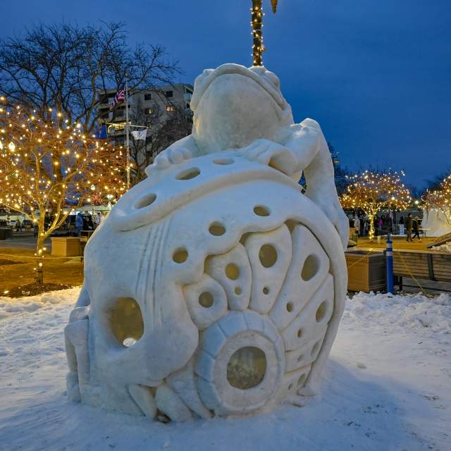 Snow sculpture at night from Winterfest 2025.