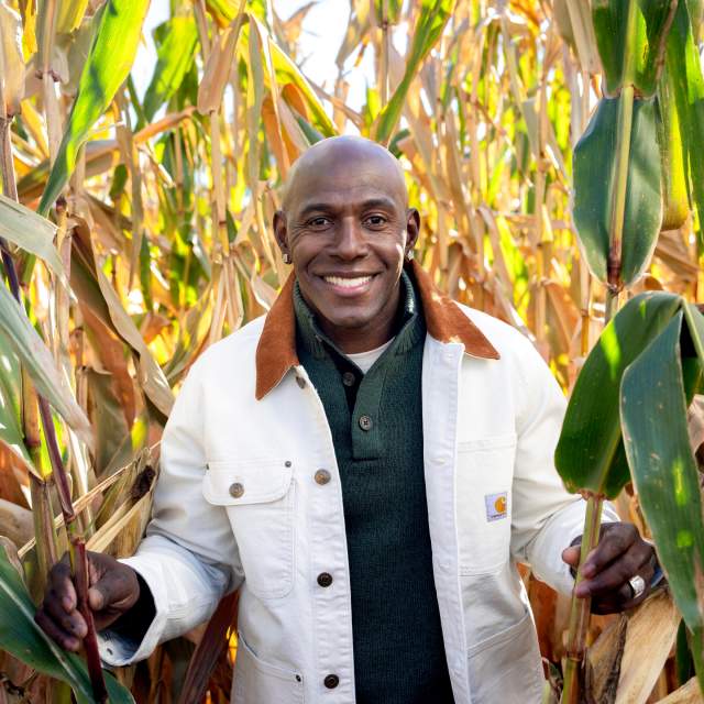 Donald Driver in a corn field by Pearce's Farm Stand.