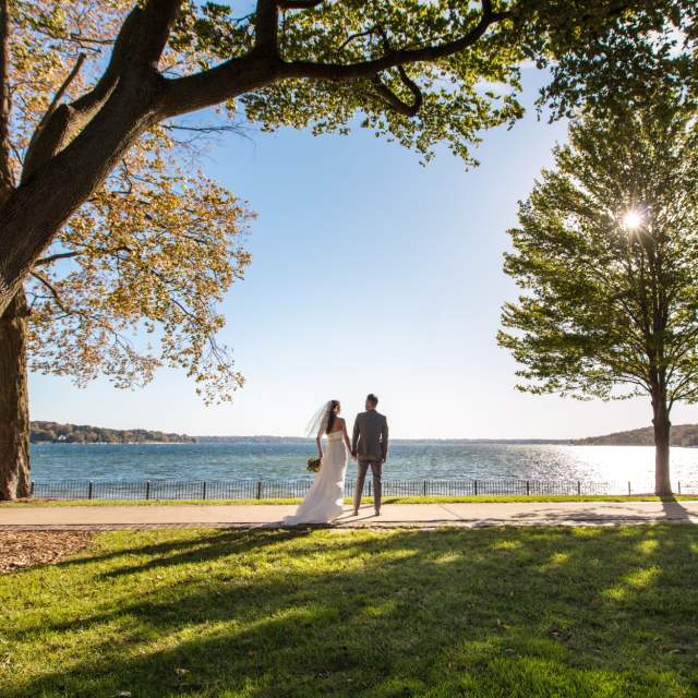 Wedding couple standing overlooking Geneva Lake