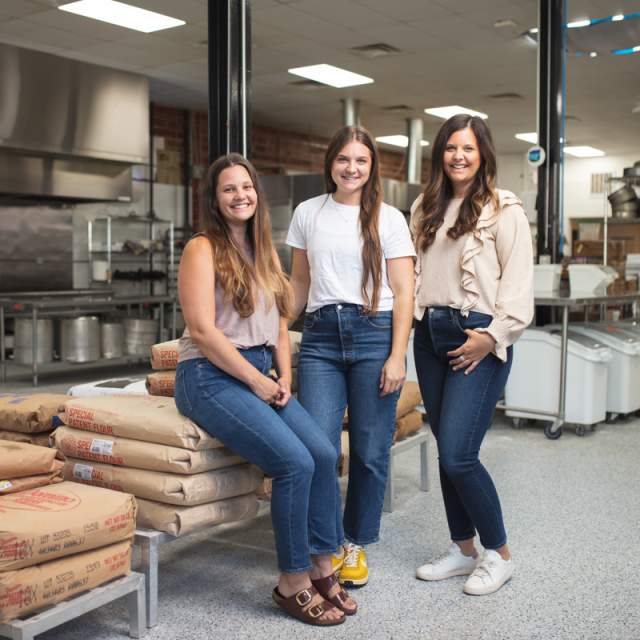 three young women sitting