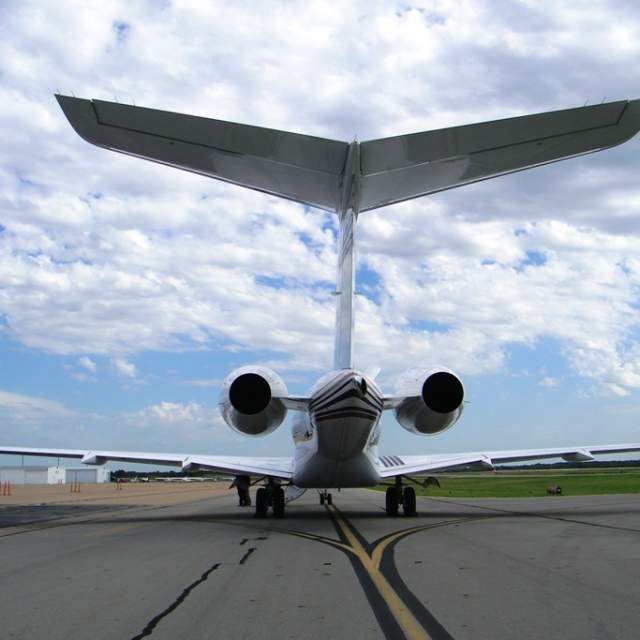 Photo of the tail of a jet at the McKinney National Airport