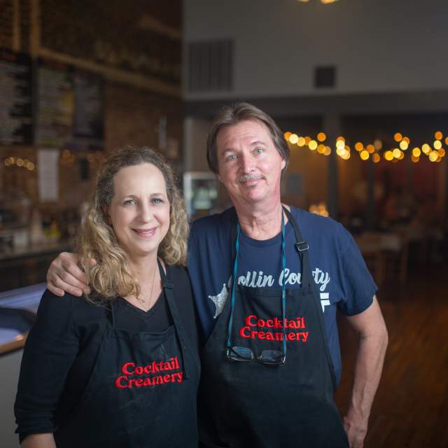 man and woman wearing Cocktail Creamery aprons