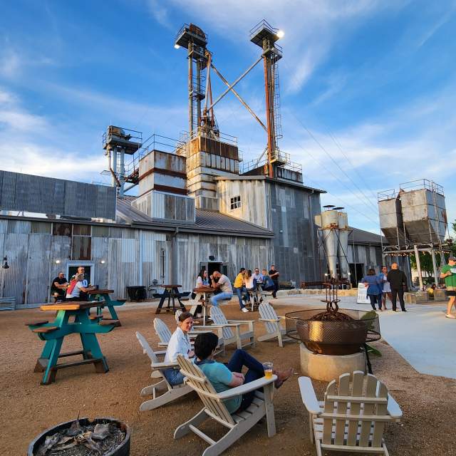 Outdoor seating in adirondack chairs and picnic tables at TUPPS