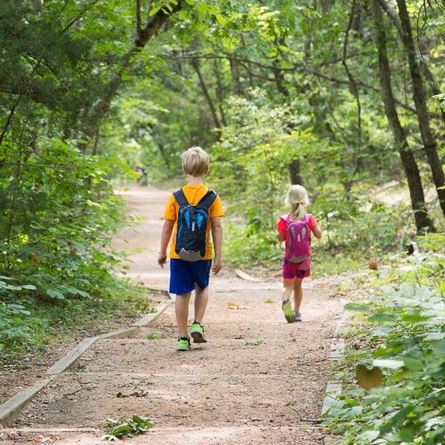 Two children walking on the trails at The Heard Museum