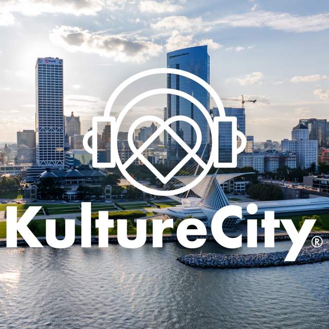 Milwaukee skyline along Lake Michigan with a KultureCity logo overlay in white
