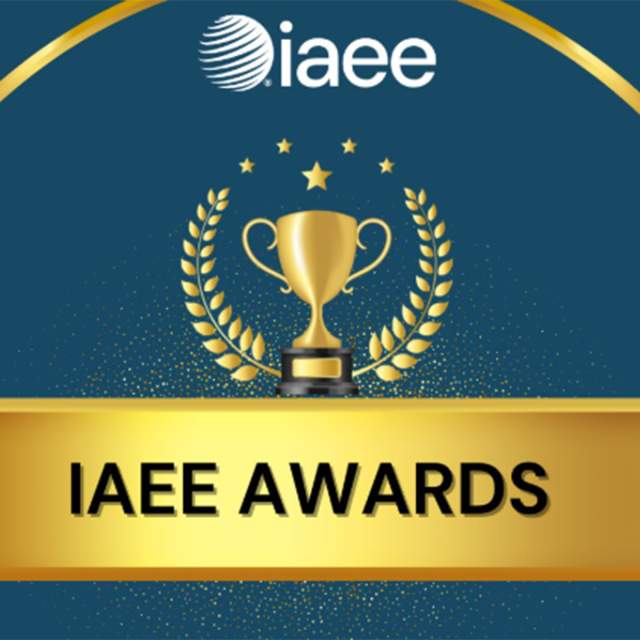 IAEE Awards graphic featuring a gold trophy centered within a laurel wreath on a dark blue background, with the IAEE logo at the top and a gold banner across the bottom reading ‘IAEE AWARDS.’