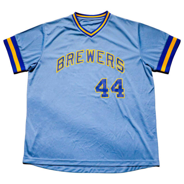 A light blue Milwaukee Brewers jersey with yellow and navy trim, featuring “Brewers” across the chest and the number 44 on the front.