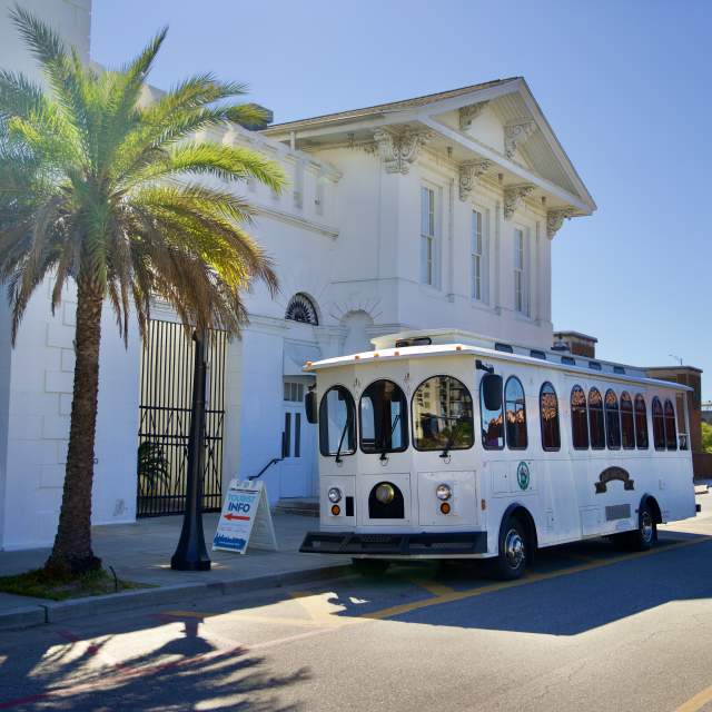 tour bus parked in front of the History Museum