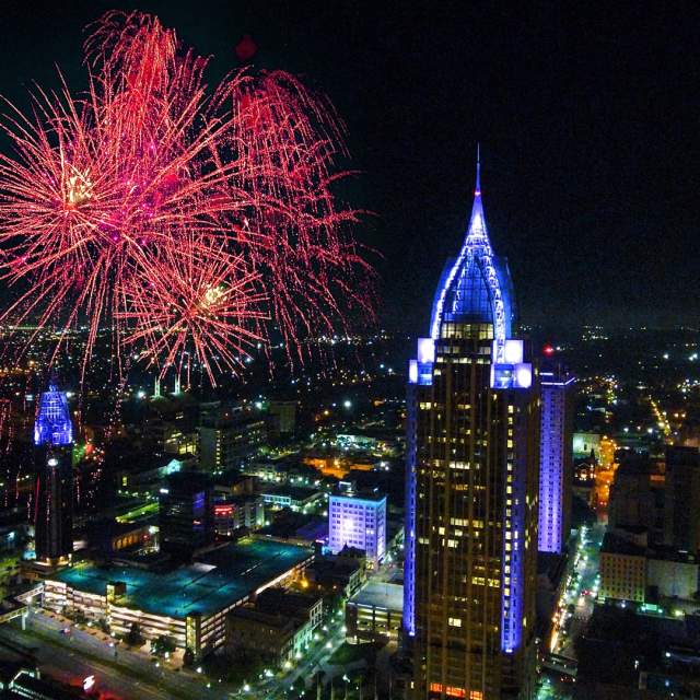 Downtown Mobile at night with fireworks in the sky