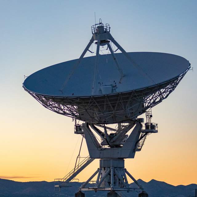 The radio telescope at the VLA Observatory in Socorro County, New Mexico at sunset