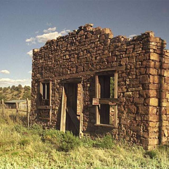 A broken down brick house in the ghost town of Chloride, NM