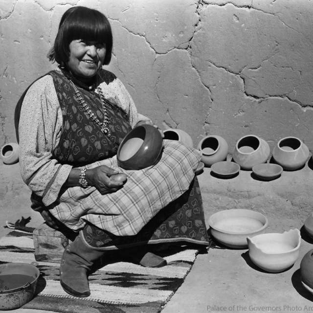 Maria Martinez polishing pottery, San Ildefonso Pueblo, New Mexico