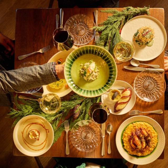 Traditional New Orleans Reveillon dinner at MaMou with seasonal dishes and warm holiday ambiance.