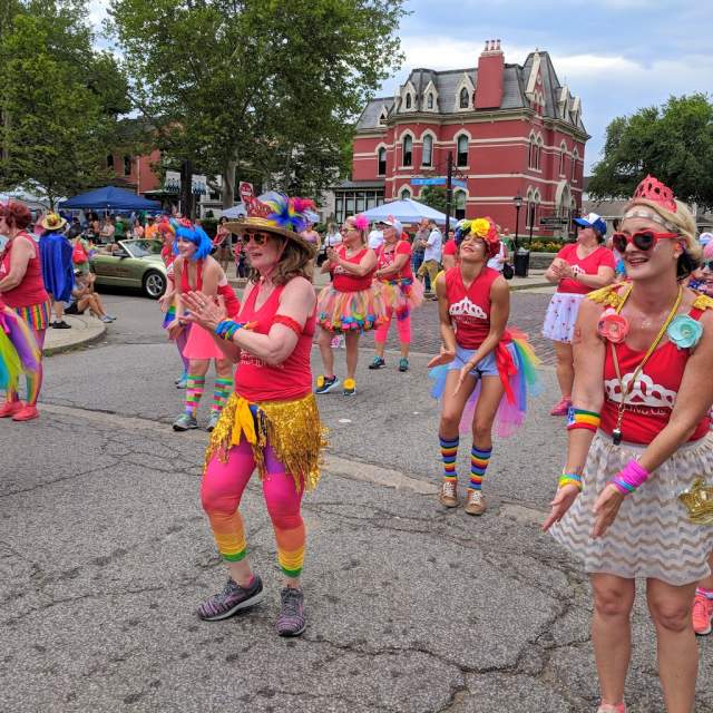 A women's dance group dressed in Pride colors at NKY Pride in Mainstrasse Village